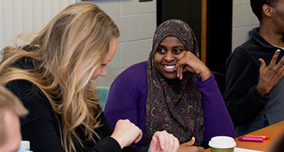 Two Counseling graduate students work during class