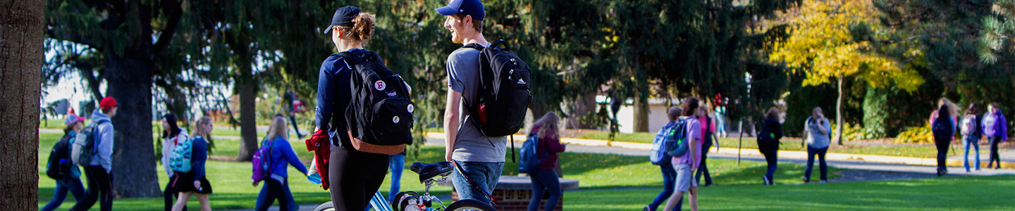 Two students walk to class on an afternoon in the fall