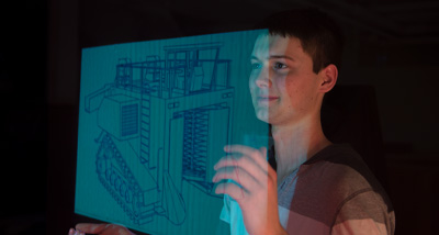 Agricultural Education student views a technical drawing of a tractor