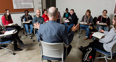Group of School Psychology Graduate students hold a discussion in class 