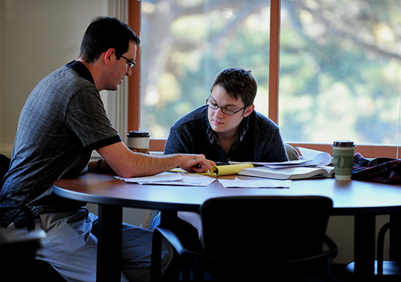 A student receives help with their homework during a tutoring session